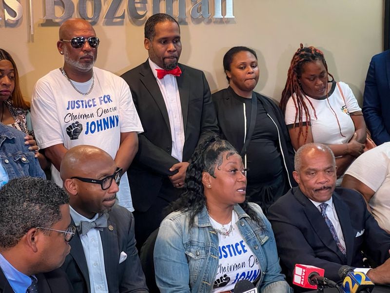 Arnitra Hollman (center), Johnny Hollman's daughter, addressed the media at a news conference Tuesday following the firing of Atlanta police Officer Kiran Kimbrough.