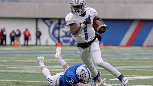 Dec. 30, 2020 - Atlanta, Ga: Pierce County running back DJ Bell (1) scores the game-winning touchdown in overtime to win 13-7 against Oconee County during the Class 3A state high school football final at Center Parc Stadium Wednesday, December 30, 2020 in Atlanta. JASON GETZ FOR THE ATLANTA JOURNAL-CONSTITUTION






