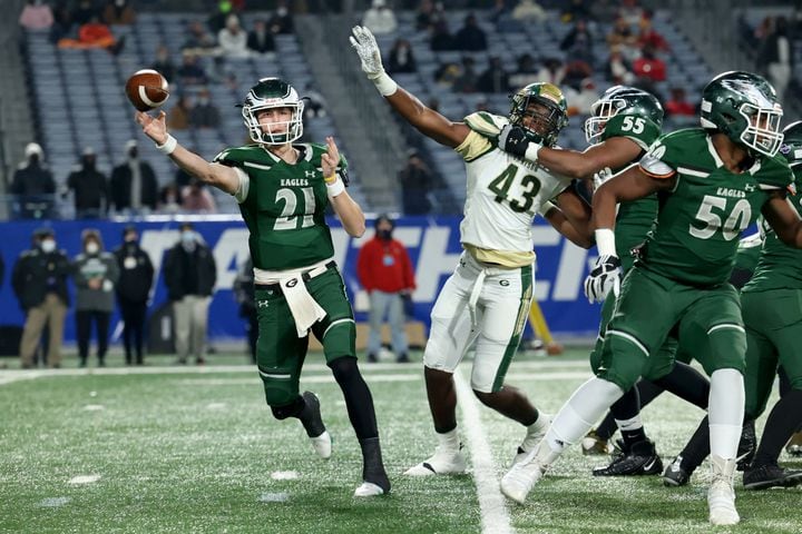 Dec. 30, 2020 - Atlanta, Ga: Collins Hill quarterback Sam Horn (21) attempts a pass as he is pressured by Grayson defensive lineman Noah Collins (43) during the first half of their Class 7A state high school football final at Center Parc Stadium Wednesday, December 30, 2020 in Atlanta. JASON GETZ FOR THE ATLANTA JOURNAL-CONSTITUTION