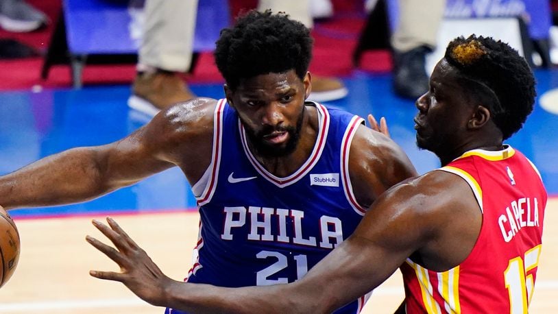Philadelphia 76ers' Joel Embiid, left, tries to get past Atlanta Hawks' Clint Capela during the first half of Game 2 in a second-round NBA basketball playoff series, Tuesday, June 8, 2021, in Philadelphia. (AP Photo/Matt Slocum)