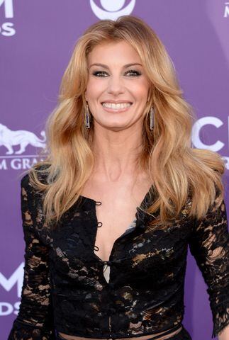 Faith Hill was adopted at one week old by Edna Perry, a bank teller, and Ted, a factory worker, who already had two biological sons.