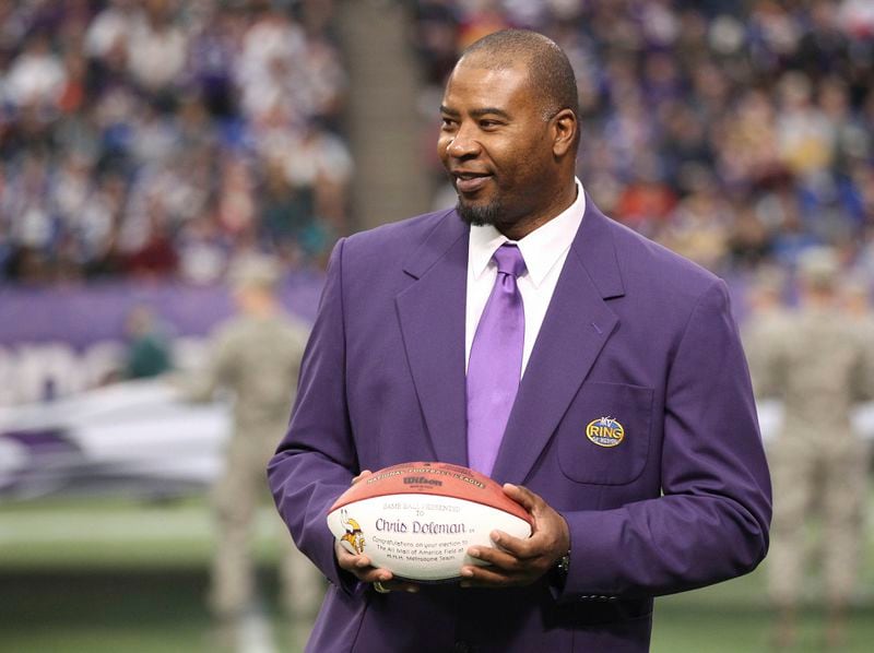 FILE - In this Dec. 15, 2013, file photo, former Minnesota Viking Chris Doleman acknowledges the crowd during a ceremony honoring the All Mall of America Field team during halftime of an NFL football game between the Vikings and the Philadelphia Eagles in Minneapolis. Hall of Fame defensive end Doleman, who became one of the NFL's most feared pass rushers during 15 seasons in the league, has died. He was 58. The Vikings and Pro Football Hall of Fame president and CEO David Baker offered their condolences in separate statements late Tuesday night, Jan. 29, 2020. (AP Photo/Andy King, File)