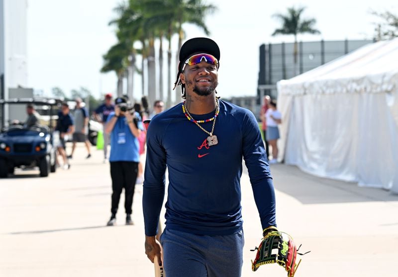 Atlanta Braves right fielder Ronald Acuna Jr. smiles as he walks to the field to take batting practice during spring training workouts at CoolToday Park, Friday, February, 16, 2024, in North Port, Florida. (Hyosub Shin / Hyosub.Shin@ajc.com)