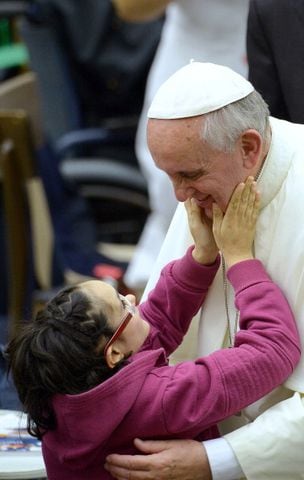 Pope Francis meets a disabled girl (November 9, 2013)