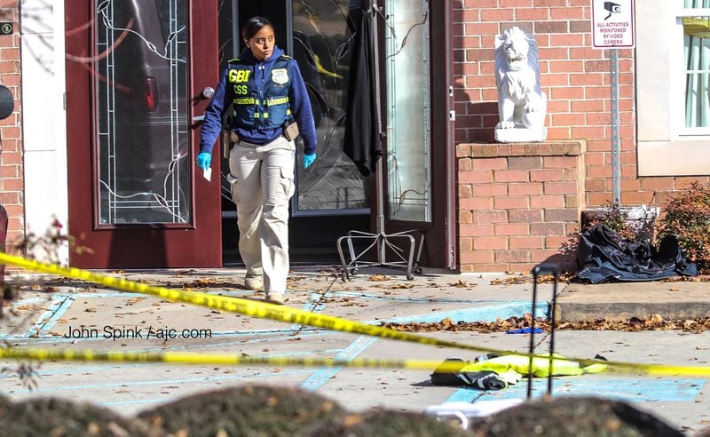 GBI agents were on the scene of an officer-involved shooting at a dentist's office on Jonesboro Road. JOHN SPINK / JSPINK@AJC.COM