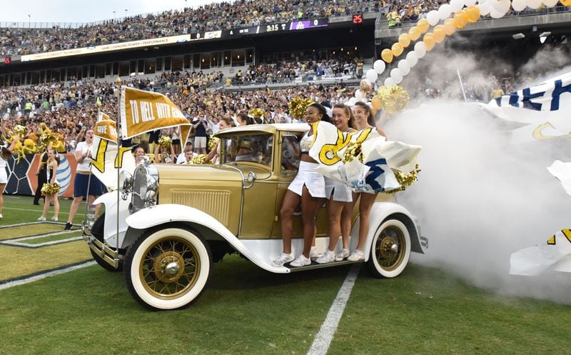 Georgia Tech’s Ramblin’ Wreck leads the band, cheerleaders, Buzz, players, and coaches before the start of the Georgia Tech season opener against the Alcorn State Braves in Bobby Dodd Stadium on Thursday, September 3, 2015. HYOSUB SHIN / HSHIN@AJC.COM