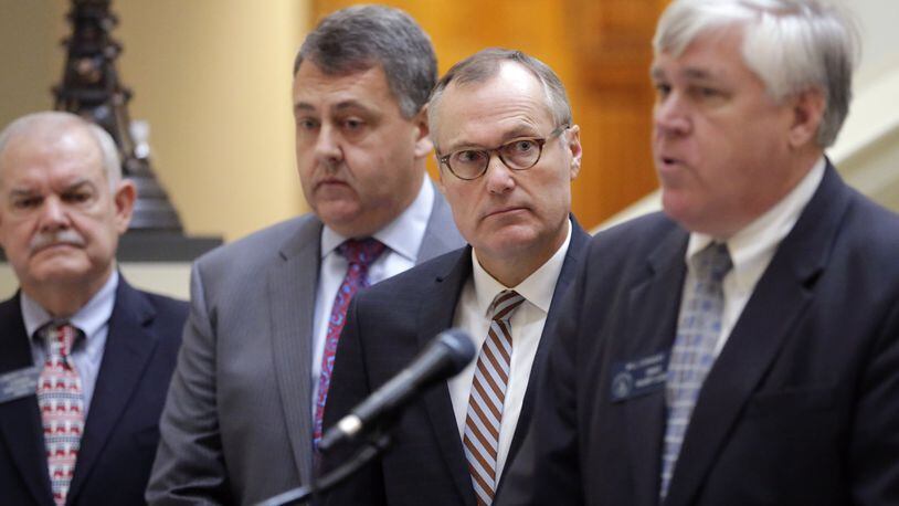 Lt. Gov. Casey Cagle (center right) looks on as he and Senate Majority Leader Bill Cowsert, R-Athens, right, and others announce the Senate’s 2017 legislative priorities at a press conference Thursday at the state Capitol. BOB ANDRES /BANDRES@AJC.COM