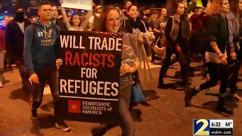 Anti-Trump protesters march through downtown Atlanta on Wednesday night, November 9, 2016 (Credit : Channel 2 Action News / WSB-TV)