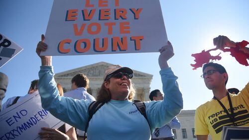 WASHINGTON, DC - Demonstrators gather outside of The U.S. Supreme Court Tuesday, October 3, during oral arguments in Gill v. Whitford to call for an end to partisan gerrymandering. OLIVIER DOULIERY/GETTY IMAGES