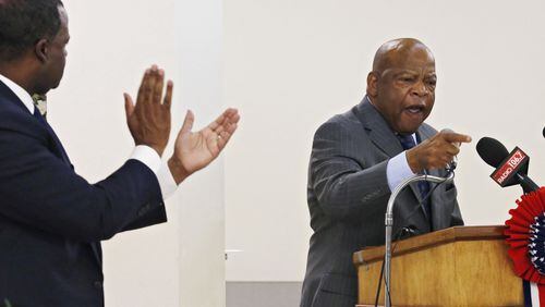 Aug. 4, 2015 - Atlanta - Atlanta Mayor Kasim Reed (left) applauds as Congressman John Lewis delivers his remarks, which included his experiences in Selma in 1965 on the Edmund Pettus Bridge. Andrew Young, Dr. Joseph Lowery, Rev. Jesse Jackson, Martin Luther King III and Congressman John Lewis joined others at the 50th Observance of the Struggle for the 1965 Voting Rights Act Luncheon at the Wheat Street Baptist Church today, part of an all day dialog held at the church. BOB ANDRES / BANDRES@AJC.COM