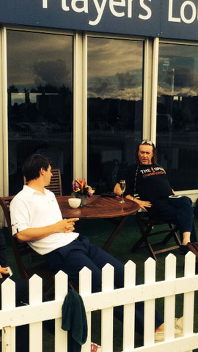 Ollie Schniederjans chats over a cool drink with Miguel Angel Jimenez at the Scottish Open. Schniederjans enjoying a post-tournament beverage with