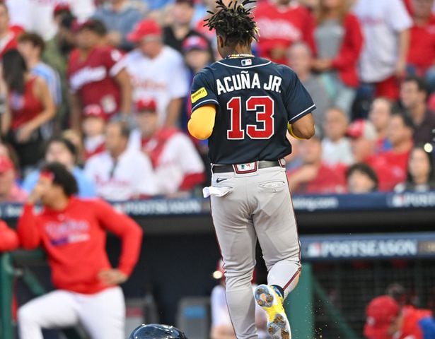 Atlanta Braves’ Ronald Acuna Jr. (13) scores on a single by teammate Ozzie Albies during the third inning of NLDS Game 3 in Philadelphia on Wednesday, Oct. 11, 2023.   (Hyosub Shin / Hyosub.Shin@ajc.com)