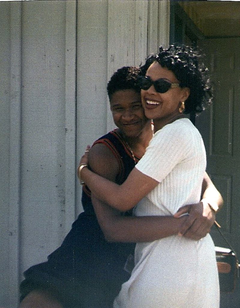 Usher hugs LaFace Records senior director of marketing Sheri Riley ahead of a performance with Denver Nuggets in 1994.
(Courtesy of Sheri Riley)