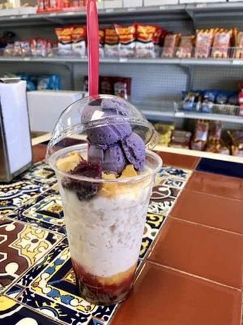 Mix together the rainbow layers of halo-halo, a traditional Filipino treat that features ube (purple yam) ice cream and is sold at Filipino market Manila Mart on Buford Highway in Doraville. CONTRIBUTED BY ANGELA HANSBERGER