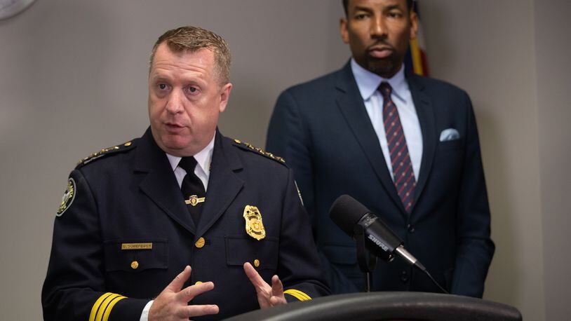 Interim Chief Darin Schierbaum (left) urged more residents and business owners to register their surveillance cameras with the city in an effort to solve and deter crime. 
(Steve Schaefer / steve.schaefer@ajc.com)