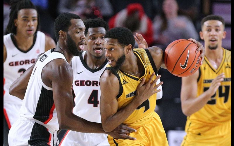 Kennesaw State guard Tyler Hooker works against the Georgia defense during the first half in their NCAA college basketball game on Tuesday, Nov. 27, 2018, in Athens. (Curtis Compton/AJC)