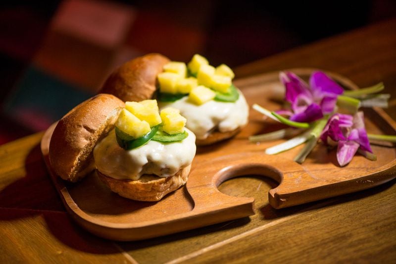 Tiki Tango Aloha Sliders, with Angus ground beef patties topped with white American cheese, fresh jalepenos and pineapple. Photo credit- Mia Yakel.