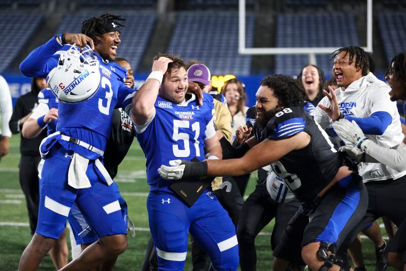 Blue Team long snapper Jack Bernstein (51) celebrates with teammates after he was awarded a scholarship at halftime of the Spring Game at Center Parc Stadium, Thursday, March 9, 2023, in Atlanta. Jason Getz / Jason.Getz@ajc.com)
