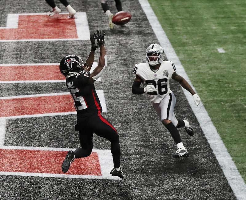 Falcons wide receiver Brandon Powell catches a touchdown pass in the end zone past Las Vegas Raiders cornerback Nevin Lawson during the third quarter Sunday, Nov. 29, 2020, at Mercedes-Benz Stadium in Atlanta. (Curtis Compton / Curtis.Compton@ajc.com)