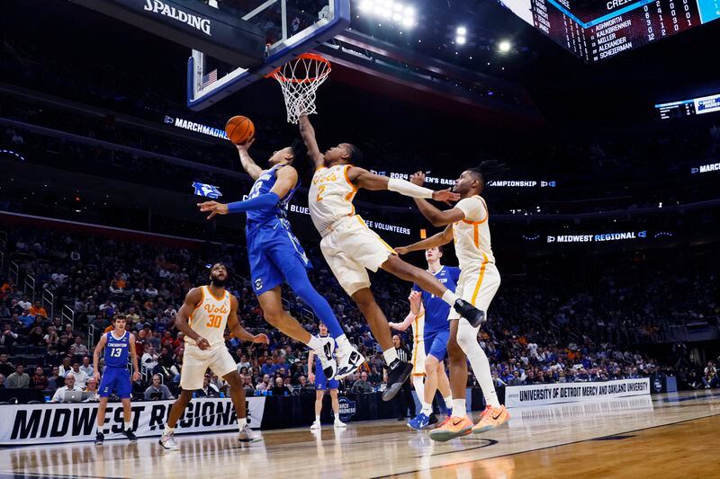 Creighton guard Trey Alexander (23), defended by Tennessee guard Jordan Gainey (2) attempts a layup during the first half of a Sweet 16 college basketball game in the NCAA Tournament, Friday, March 29, 2024, in Detroit. (AP Photo/Duane Burleson)