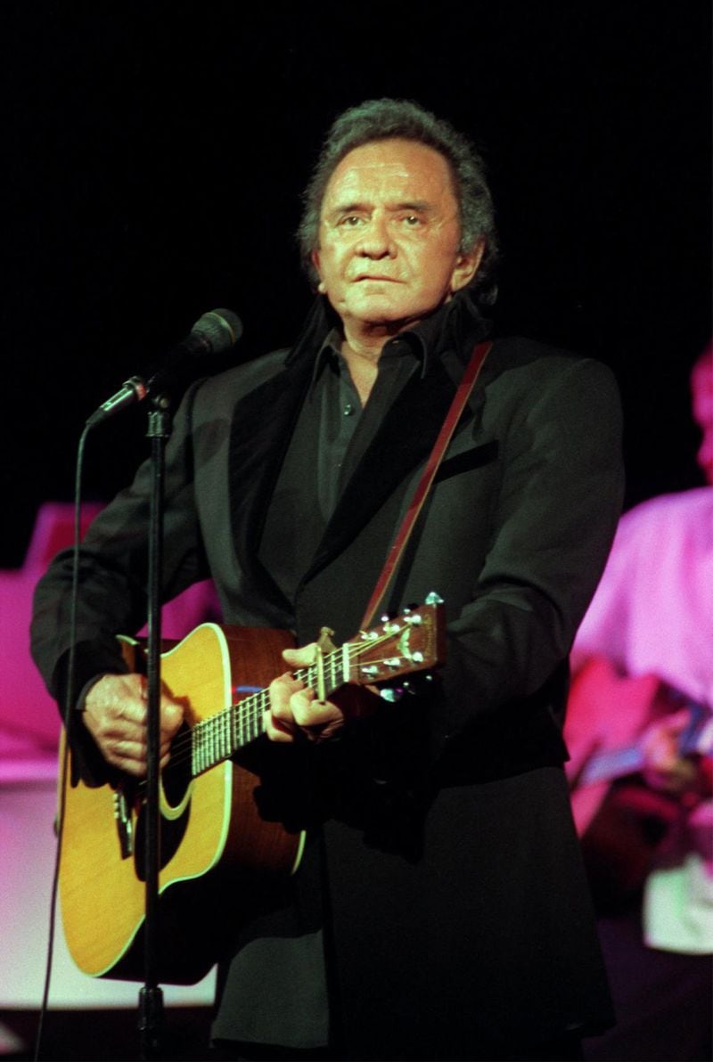 The music of Johnny Cash comes to Roswell this month. In this historic photo, the man himself performs in 1997 at the Majestic Theatre in downtown Dallas. PHOTO: MICHAEL AINSWORTH/DALLAS MORNING NEWS