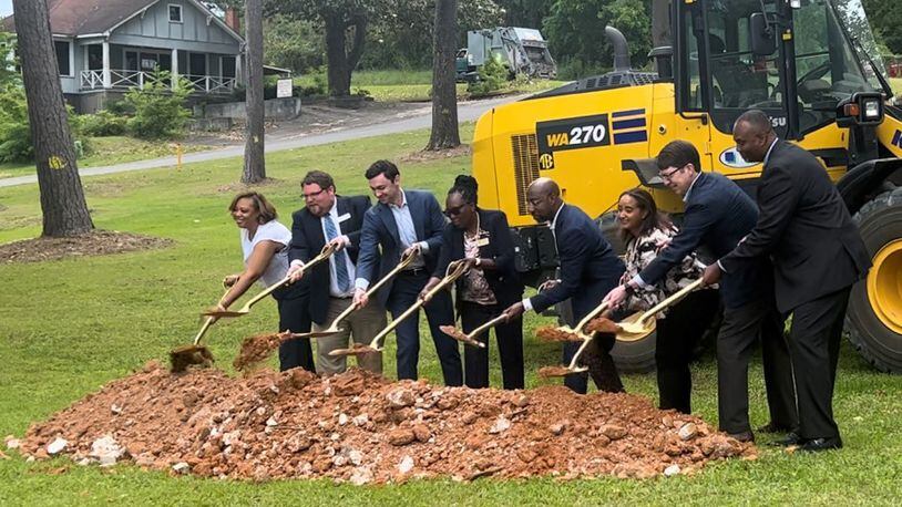 U.S. Sens. Jon Ossoff and Raphael Warnock help local officials in McIntyre break ground on a new sewer system.