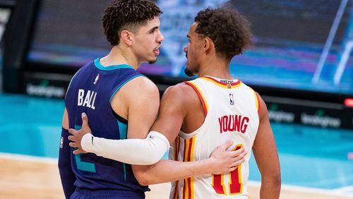 Charlotte Hornets guard LaMelo Ball (2) and Atlanta Hawks guard Trae Young (11) talk to each other after an NBA basketball game in Charlotte, N.C., Saturday, Jan. 9, 2021. The Hornets won 113-105. (AP Photo/Jacob Kupferman)