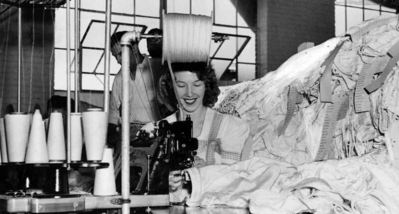 Louise Bennett makes parachutes on a high-speed machine that sews with six needles at once, in the Owen Osbone plant at Gainesville. September 5, 1943.