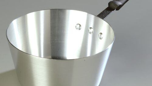 The Carlisle 5.5-quart tapered saucepan comes with a heat-proof sleeve on the handle.