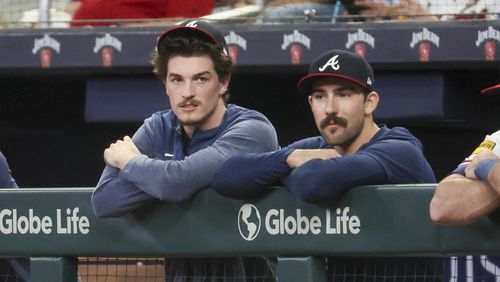 Braves starting pitchers Max Fried, left, and Spencer Strider watch a 2023 game together in the dugout. File photo by Jason Getz / Jason.Getz@ajc.com