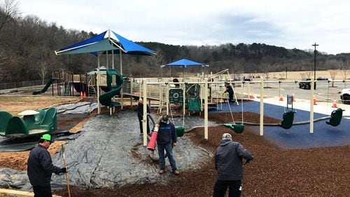 Workers prepare the “inclusive” playground for special needs children at Etowah River Park in Canton. A ribbon-cutting ceremony to officially open the play area is set for 3 p.m., Feb. 20. CITY OF CANTON