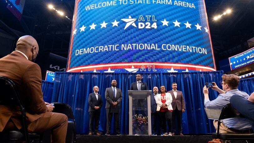 Atlanta Mayor Andre Dickens, Democratic National Committee Chair Jaime Harrison and U.S. Rep. Nikema Williams speak to journalists in July after touring State Farm Arena, the keystone in Atlanta's bid to host the 2024 Democratic National Convention. The bid could bring 5,000 delegates and 45,000 other visitors to the city. Ben Gray for The Atlanta Journal-Constitution