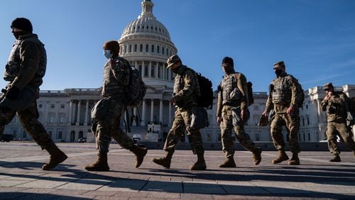 WASHINGTON, DC - JANUARY 14: Members of the National Guard, outside the U.S. Capitol Building - a day after the House of Representatives impeached President Donald Trump, and over a week after a pro-Trump insurrectionist mob breached the security of the nation's capitol - on Thursday, Jan. 14, 2021 in Washington, DC. (Kent Nishimura / Los Angeles Times/TNS)