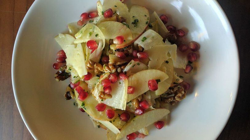 An apple and Belgian endive salad is sprinkled with pomegranate seeds. (Contributed by Spring)