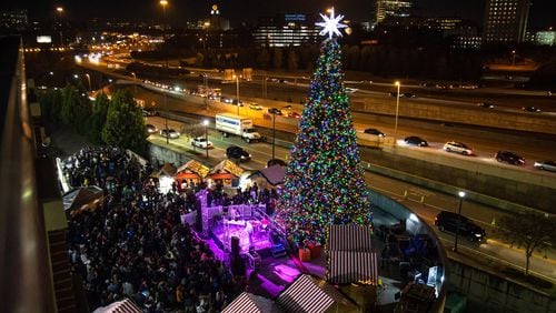 A large Christmas tree lights up during the Light the Station 2018 holiday event Saturday, November 17, 2018, at Atlantic Station in Atlanta. (Photo: STEVE SCHAEFER / SPECIAL TO THE AJC)
