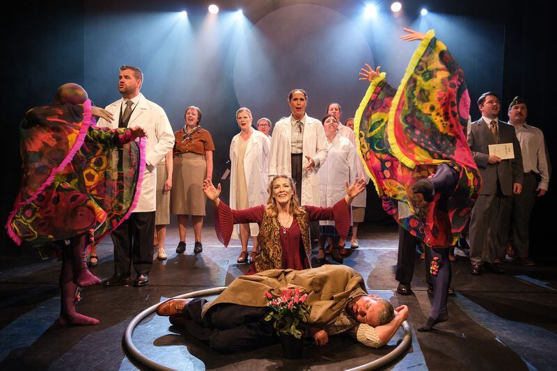 Emily Bull (down-center), James Ross (on the floor), Scott Armstrong (left), Melissa Veszi (up-center), Richard Lounds (far right) and the ensemble of Charades Theatre Company’s production of “The Mold that Changed the World”
(Courtesy of Skollar PR / Robin Mair)