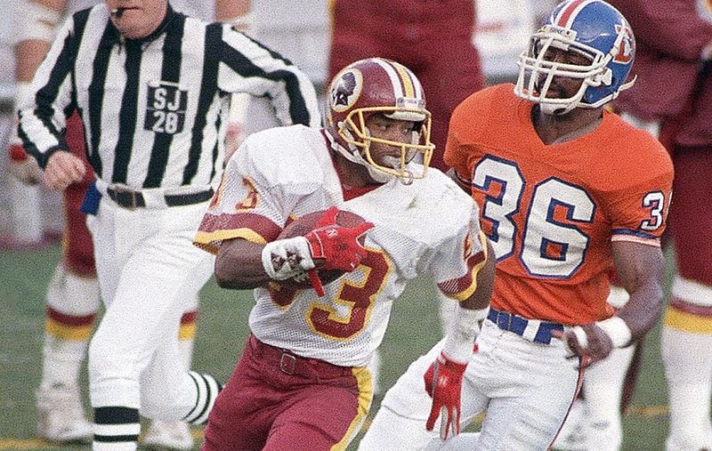 1988 Super Bowl: This Super Bowl came at the end of a season that was shortened by a players' strike. Washington quarterback Doug Williams, who set a Super Bowl record with 340 yards passing, became the first African-American quarterback to win a Super Bowl. Washington won 42-10. Redskins receiver Ricky Sanders (83) caught nine passes for 193 yards and two touchdowns, breaking one record and tying another. The Redskins scored 42 unanswered points, including a record-breaking 35 points in the second quarter.