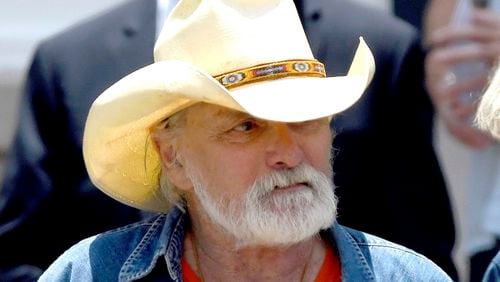 Dickey Betts, a founding member of the Allman Brothers Band, exits the funeral of Gregg Allman at Snow's Memorial Chapel, June 3, 2017, in Macon, Ga. Guitar legend Betts, who co-founded the Allman Brothers Band and wrote their biggest hit, “Ramblin’ Man,” died Thursday, April 18, 2024. He was 80. (Jason Vorhees/The Macon Telegraph via AP, File)