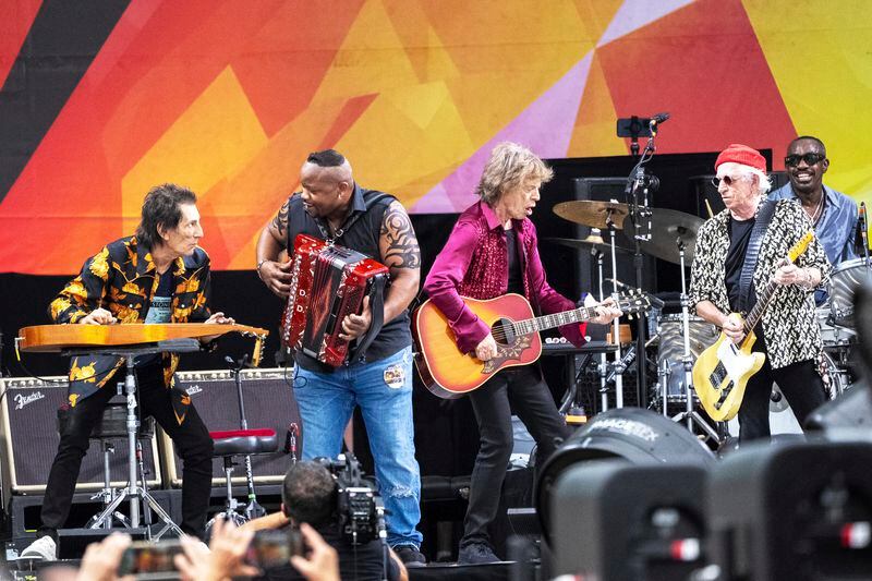 Ron Wood, left, Dwayne Dopsie, Mick Jagger, Keith Richards and Steve Jordan perform with the Rolling Stones during the New Orleans Jazz & Heritage Festival on Thursday, May 2nd, 2024, at the Fair Grounds Race Course in New Orleans. (Photo by Amy Harris/Invision/AP)