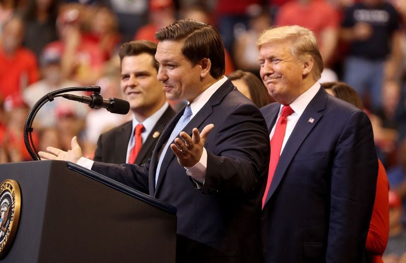 Florida Gov. Ron DeSantis (at the microphone) and then-President Donald Trump, right, are pictured at an event in 2019, before they became political opponents. (Mike Stocker/South Florida Sun Sentinel/TNS)