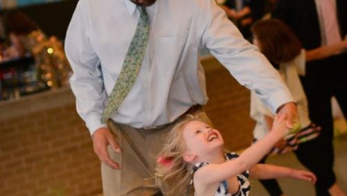 Daddy-daughter dances are a popular event but should schools hold them? (AJC File)