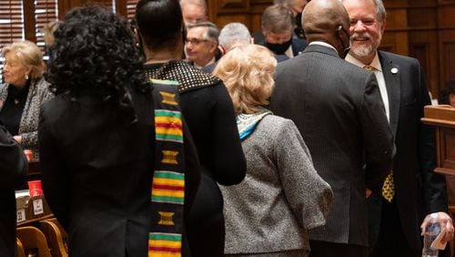 A line of representatives forms Thursday in the Georgia House to talk to Appropriations Chairman Terry England, R-Auburn, after he announced that he won’t seek reelection in November. Ben Gray for the Atlanta Journal-Constitution