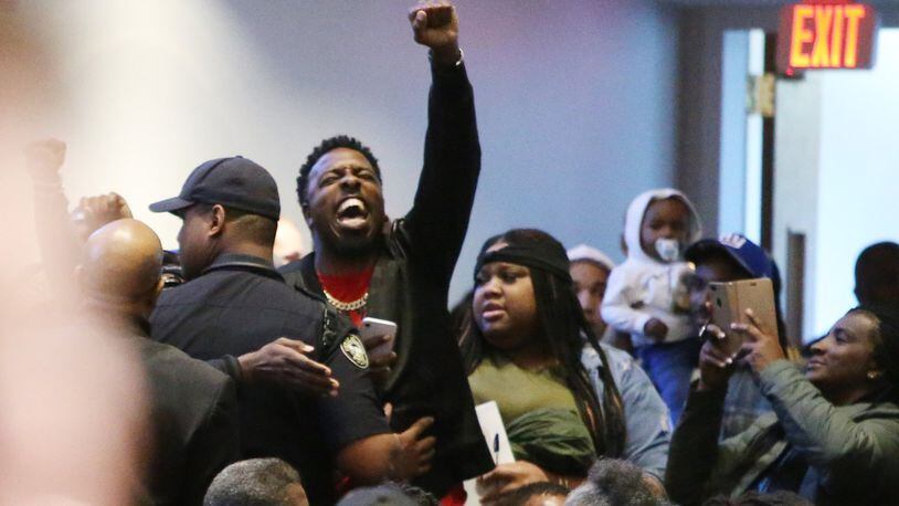 3/19/19 - Atlanta - People protest the way the death of 21-year-old Jimmy Atchison was handled by officials at a town hall hosted by Atlanta Mayor Keisha Lance Bottoms at Cascade United Methodist Church in Atlanta, Georgia on Tuesday, March 19, 2019. EMILY HANEY / emily.haney@ajc.com