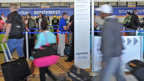 At each of Atlanta’s two major carriers — AirTran Airways and Delta Air Lines — the frequent flier programs are undergoing transformations that will change the way you earn points for free flights.