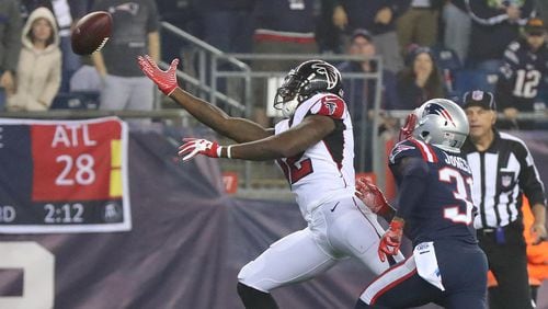 Matt Ryan overthrows Falcons receiver Mohamed Sanu in the end zone as Patriots defensive back Jonathan Jones defends during the second half in a NFL football game on Sunday, October 22, 2017, in Foxborough.   Curtis Compton/ccompton@ajc.com