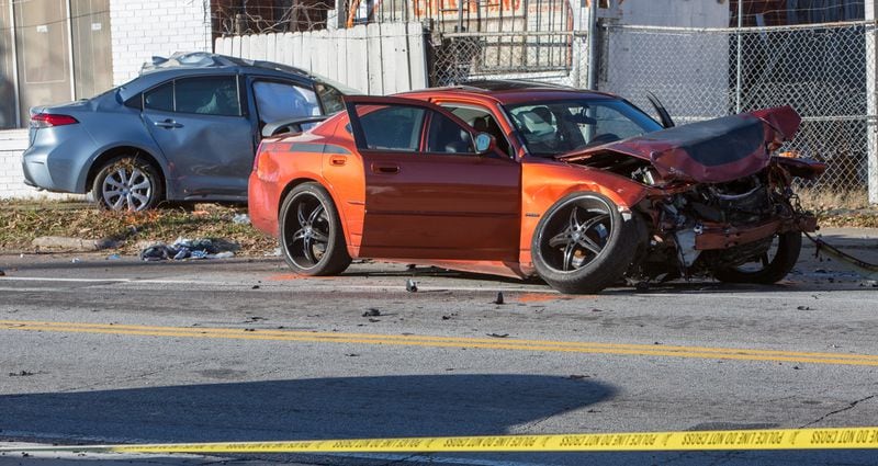 Police are still looking for the suspects who allegedly stole a car, ran a red light and crashed into a woman’s vehicle. 