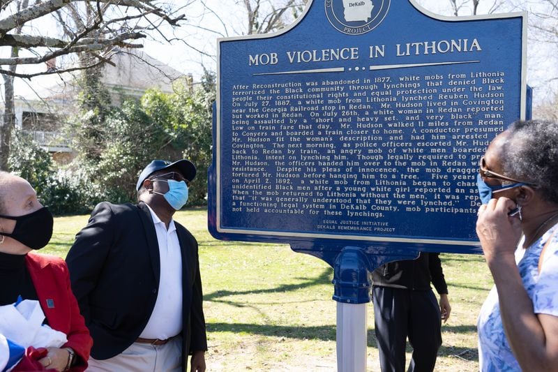 One side of the plaque is titled, “Lynching in America,” while the other says, “Mob Violence in Lithonia.”