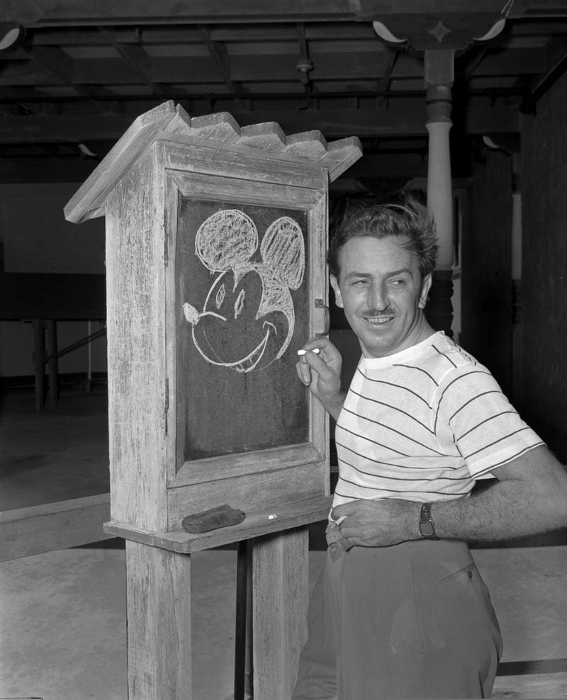FILE - Walt Disney, creator of Mickey Mouse, poses at the Pancoast Hotel, Aug. 13, 1941, in Miami, Fla. Winnie the Pooh and Mickey Mouse have recently entered the public domain, making it possible for artists to use them freely. (AP Photo, File)