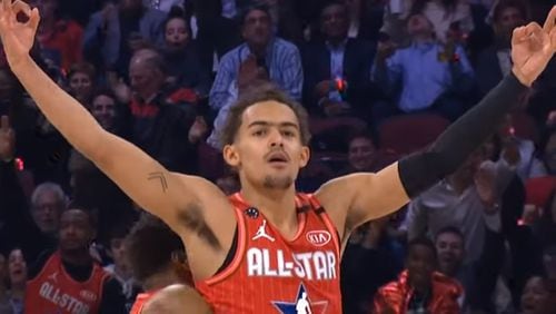 Atlanta Hawks guard Trae Young celebrates his buzzer-beating half-court shot at the end of the first half of the NBA All-Star Game Sunday, Feb. 16, 2020, in Chicago.