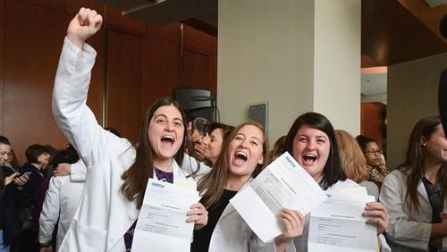 Lauren (left), Stephanie and Allison Boden, sisters and fourth-year students at Emory Medical School, celebrated the results of Match Day on March 16, when each discovered which residency program had accepted their applications. The sisters are fraternal triplets. CONTRIBUTED BY JACK KEARSE